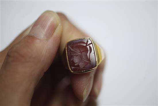 A 9ct gold and carnelian set intaglio ring and a 9ct gold and carnelian set oval signet ring.